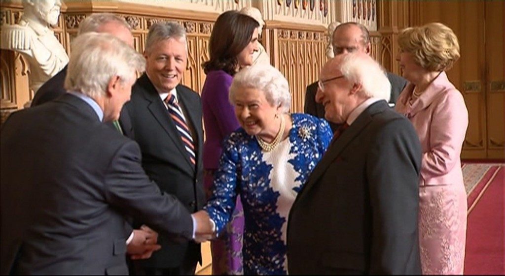 (L-R) Dr. Christopher Moran, Former Deputy First Minister Martin McGuinness, Her Majesty The Queen, His Excellency The President of Ireland Michael D. Higgins shake hands upon Irish State Visit, joined by His Royal Highness The Prince Philip, Duke of Edinburgh; Mrs. Sabina Higgins; and Secretary of State for Norther Ireland Theresa Villiers 