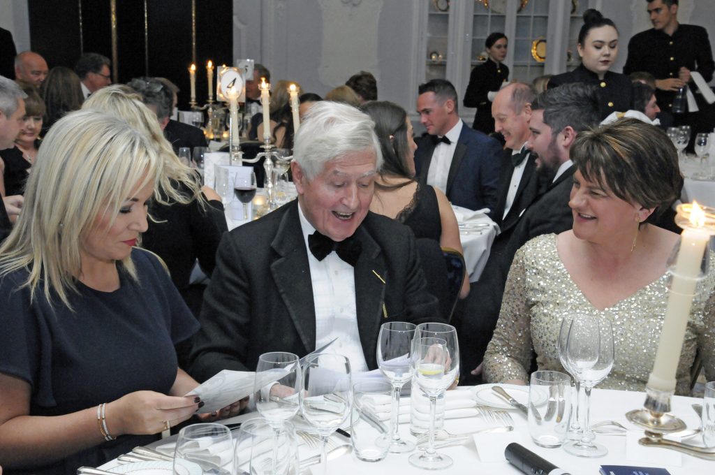 (L-R) Michelle O'Neill, Sinn Féin, Dr Moran and DUP Leader Arlene Foster share a laugh at the Co-operation Ireland Chairman's Dinner