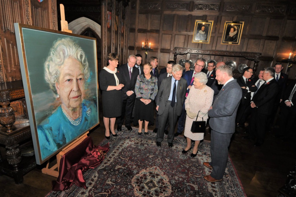 Her Majesty The Queen unveils a portrait of herself by Northern Irish artist Colin Davison at Crosby Moran Hall, the home of Dr. Christopher Moran, as representatives of British and Irish Governments and all of the political parties of Northern Ireland join together in celebration of the occasion, in 2016